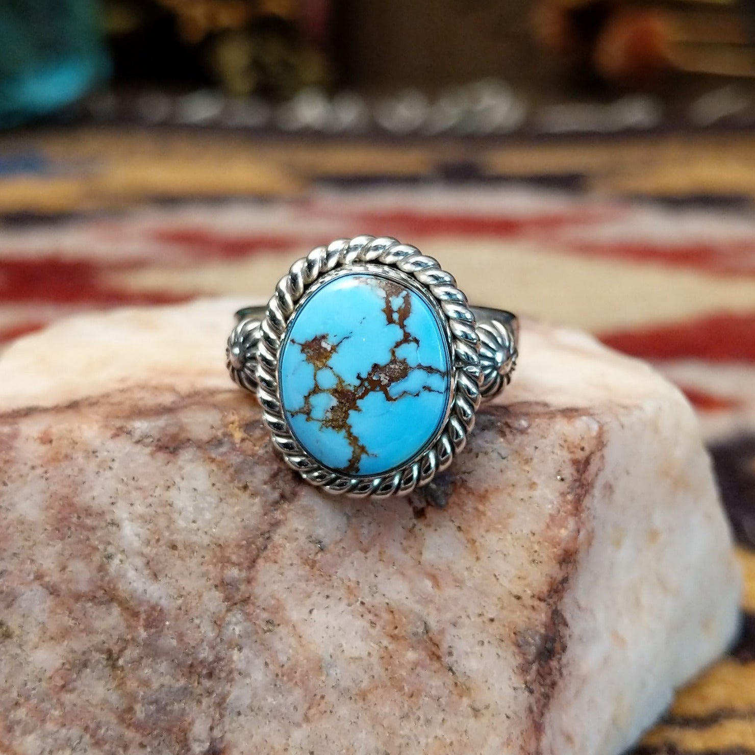 Handcrafted sterling silver circle ring by Artie Yellowhorse featuring a round Golden Hills turquoise stone in a polished Southwestern Native American design.