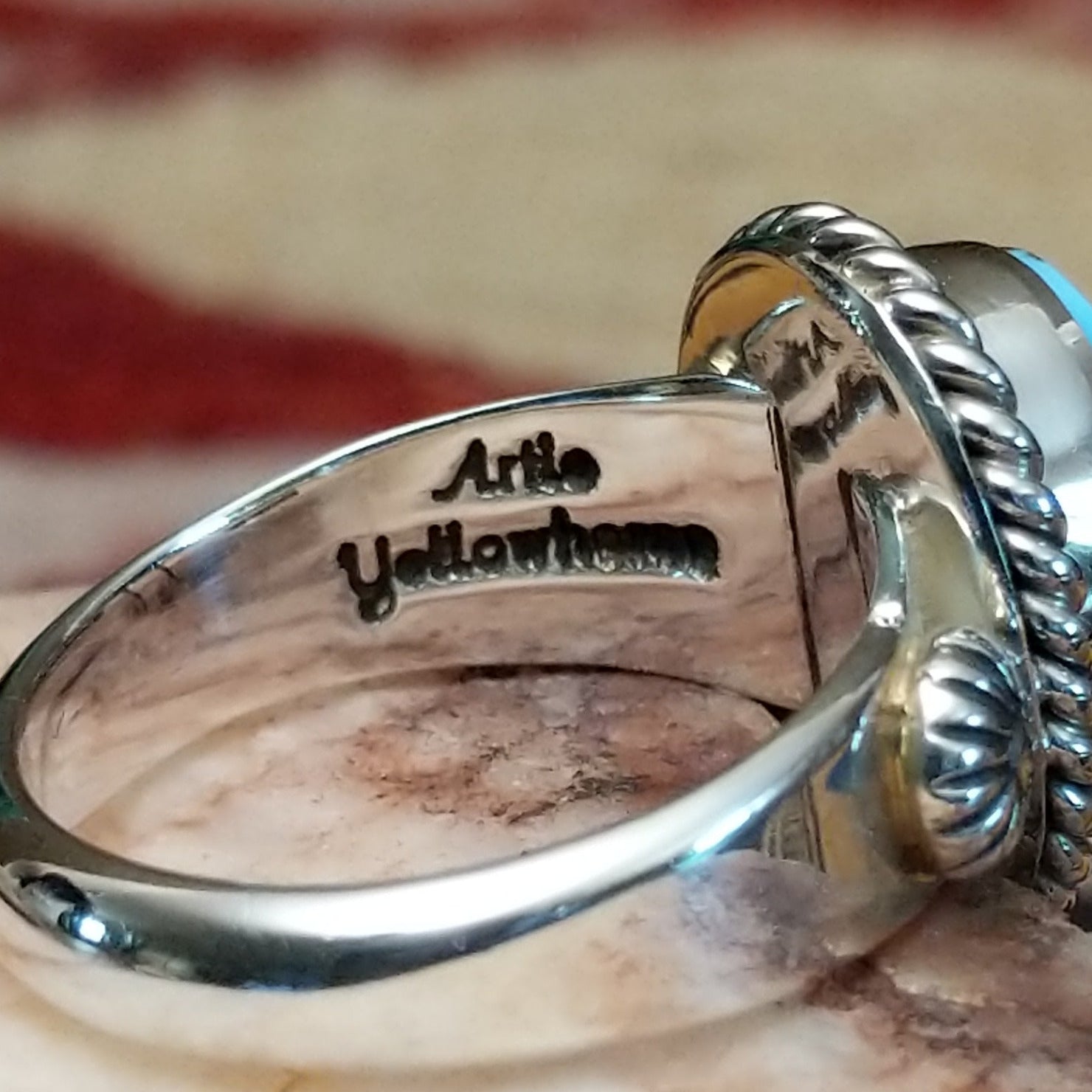 Handcrafted sterling silver circle ring by Artie Yellowhorse featuring a round Golden Hills turquoise stone in a polished Southwestern Native American design.  Artisan stamp on band.