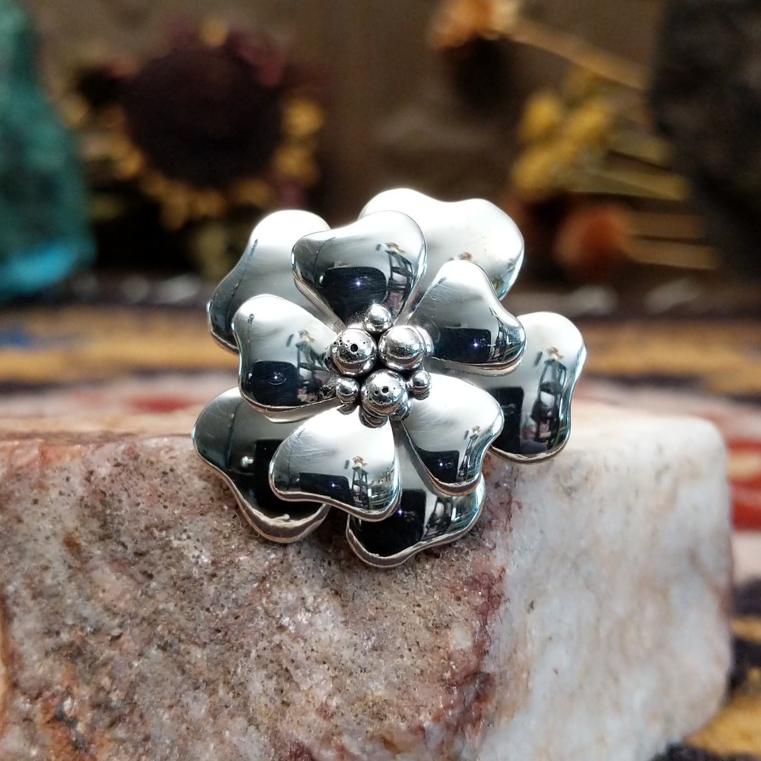 Handcrafted sterling silver dogwood flower ring by Artie Yellowhorse featuring polished floral detailing in a Southwestern Native American design.