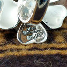 Handcrafted sterling silver dogwood flower ring by Artie Yellowhorse featuring polished floral detailing in a Southwestern Native American design.  Artisan and Sterling Silver stamp.