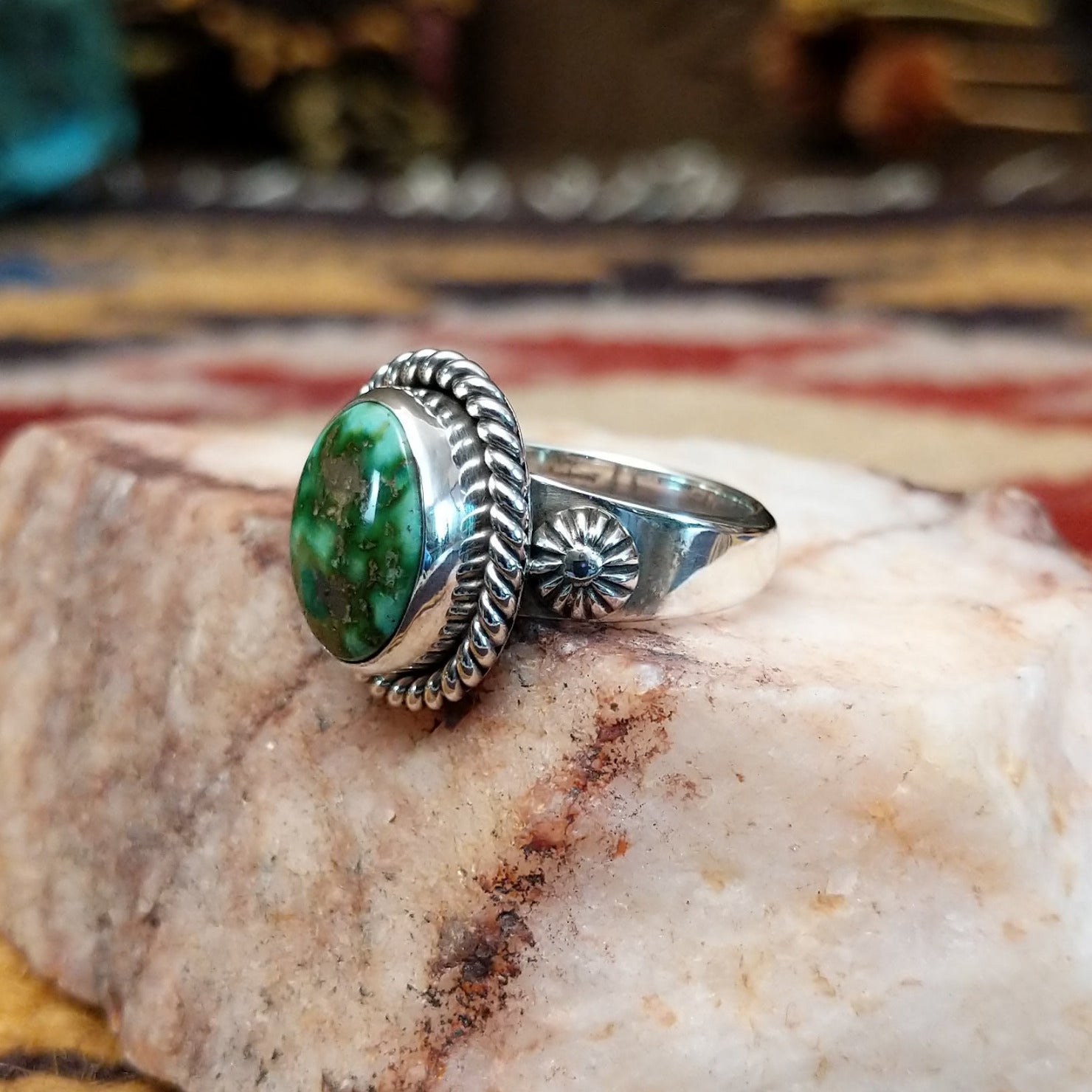 Handcrafted sterling silver circle ring by Artie Yellowhorse featuring a Sonoran Gold turquoise stone in a polished Southwestern Native American design.  Side view.