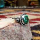 Handcrafted sterling silver circle ring by Artie Yellowhorse featuring a Sonoran Gold turquoise stone in a polished Southwestern Native American design.  Side view.