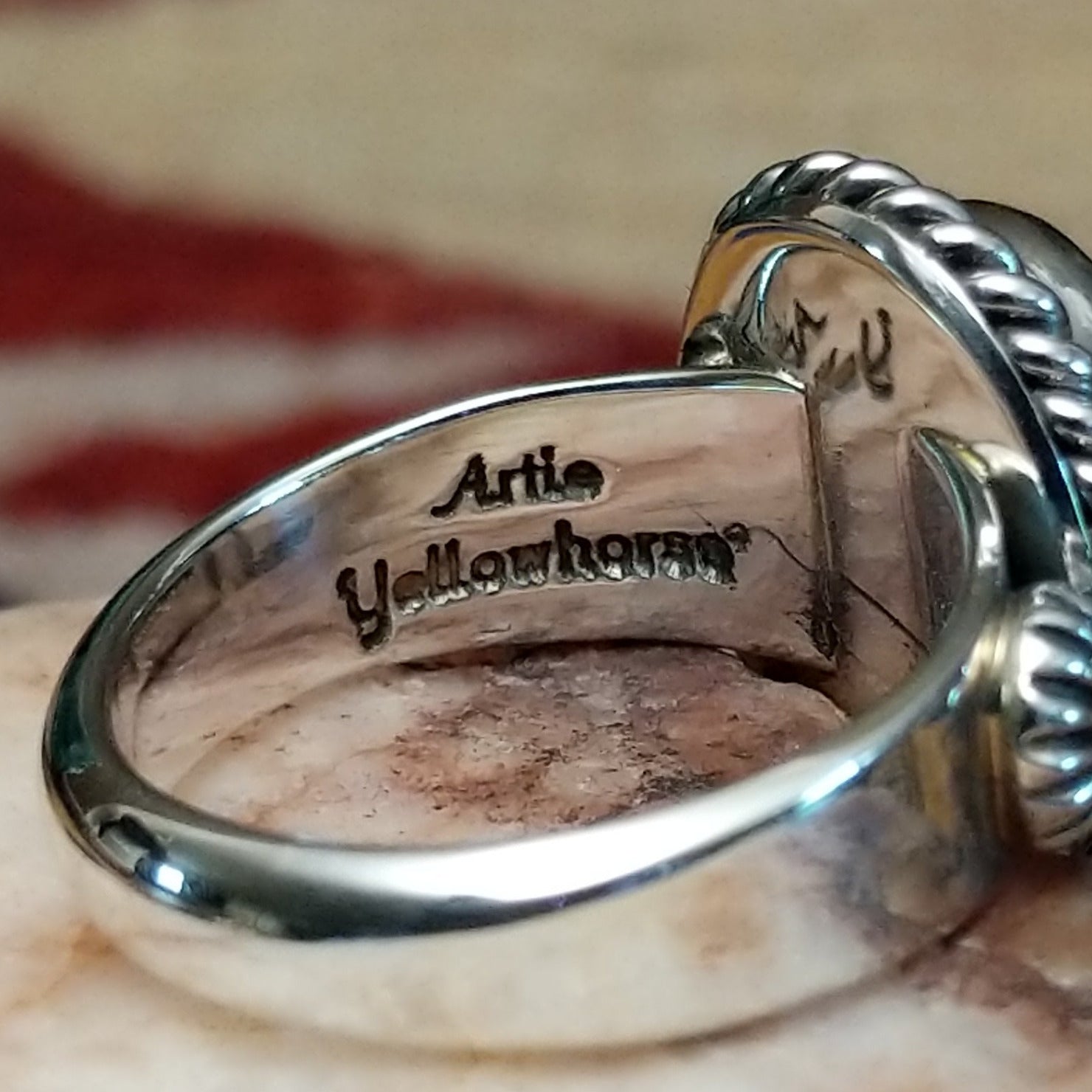Handcrafted sterling silver circle ring by Artie Yellowhorse featuring a Sonoran Gold turquoise stone in a polished Southwestern Native American design.  Artisan stamp on band.