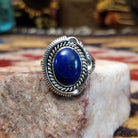 Handcrafted sterling silver oval ring by Artie Yellowhorse featuring a deep blue lapis stone in a polished Southwestern Native American design.