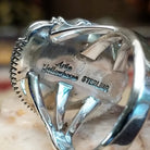 Handcrafted sterling silver oval ring by Artie Yellowhorse featuring a deep blue lapis stone in a polished Southwestern Native American design.  Artisan and Sterling Silver stamp.