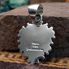 Handcrafted sterling silver pendant by Artie Yellowhorse featuring a Golden Hills turquoise stone in a polished Southwestern Native American design.  Back view showcasing artisan and Sterling Silver stamp.