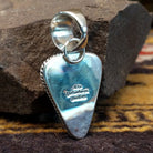Handcrafted sterling silver pendant by Artie Yellowhorse featuring a purple spiny oyster shell in a triangular Southwestern Native American design.  Back view showcasing artisan and Sterling Silver stamp.