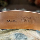 Handcrafted copper and sterling silver cuff bracelet by Robert Little featuring chevron-stamped detailing in a traditional Southwestern Native American design.  Arisan and Sterling Silver stamp.