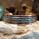 Handcrafted copper and sterling silver cuff bracelet by Navajo artisan Robert Little featuring wavy stamped detailing in a traditional Southwestern design.