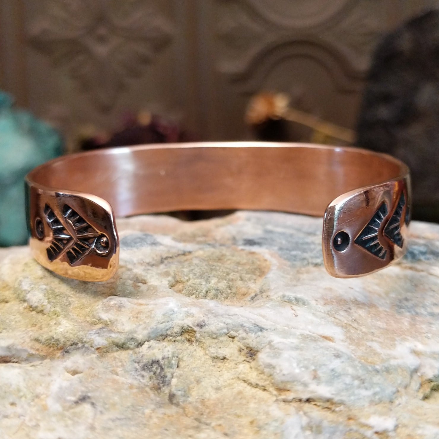 Handcrafted copper and sterling silver cuff bracelet by Navajo artisan Robert Little featuring wavy stamped detailing in a traditional Southwestern design.  Underside view.