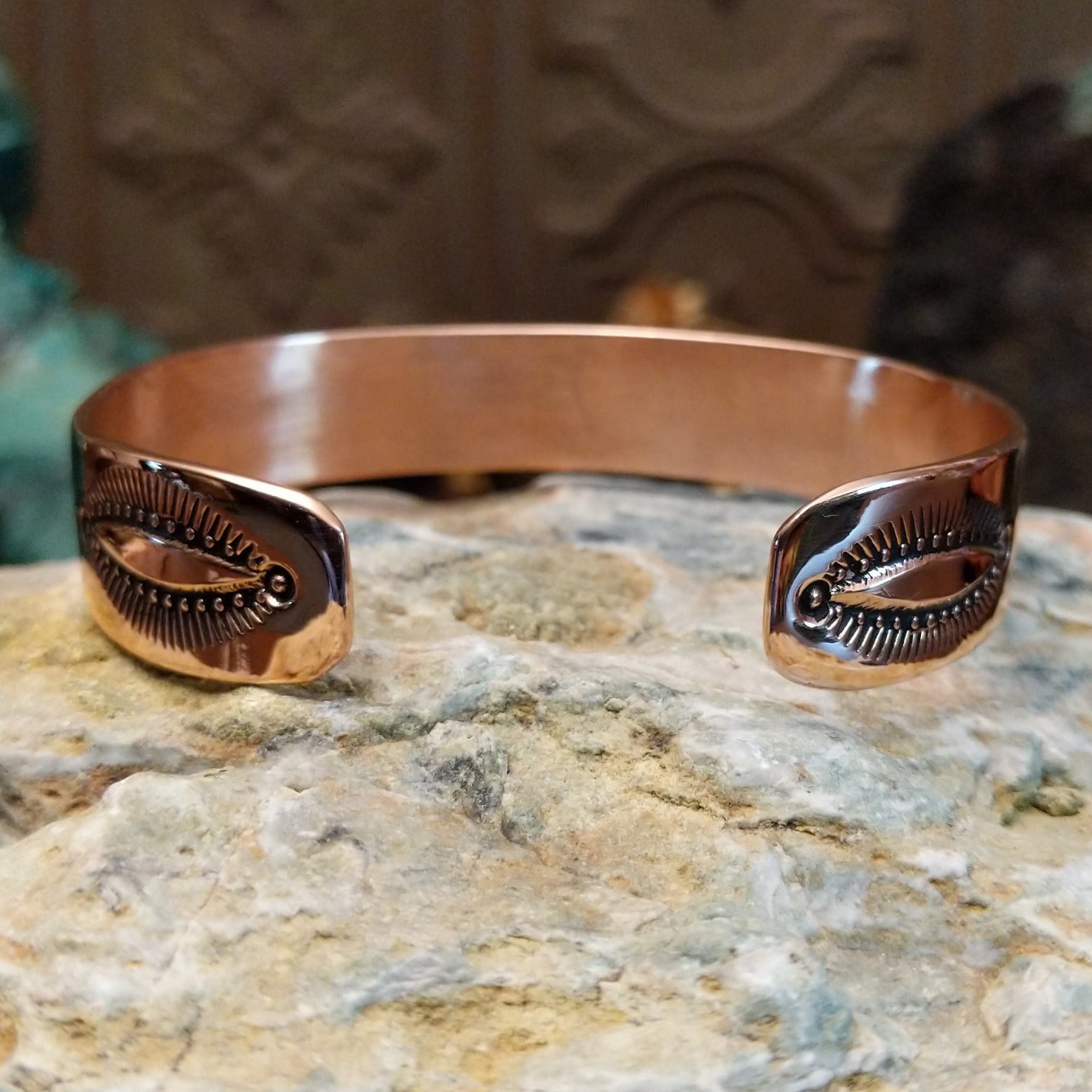 Handcrafted copper and sterling silver cuff bracelet by Navajo artisan Robert Little featuring fan-stamped detailing in a traditional Southwestern design.  Underside view.