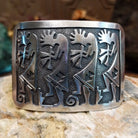 Handcrafted Navajo sterling silver cuff bracelet featuring a detailed Kokopelli design in a traditional Southwestern Native American style.