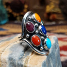 Handcrafted sterling silver multistone ring by Bernice Bonney featuring a colorful arrangement of natural gemstones in a traditional Southwestern Native American design.  Side view.