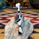 Handcrafted sterling silver ring by Bernyse Chavez featuring an elongated White Buffalo stone with natural black-and-white patterns in a Southwestern Native American design.