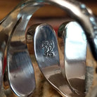 Handcrafted Navajo sterling silver teardrop ring featuring a white manmade opal with iridescent color play in a traditional Southwestern design.  Artisan and Sterling Silver stamp.