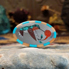 Handcrafted sterling silver hummingbird ring by Albert and Dolly Banteah featuring colorful multistone inlay in a traditional Zuni Southwestern design.