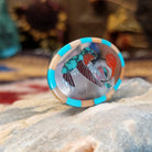 Handcrafted sterling silver hummingbird ring by Albert and Dolly Banteah featuring colorful multistone inlay in a traditional Zuni Southwestern design.  Side view.