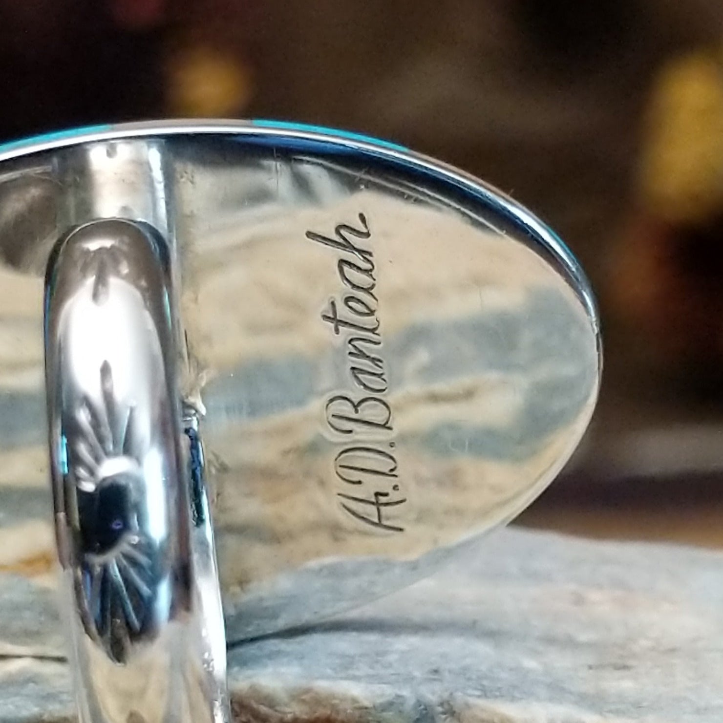Handcrafted sterling silver hummingbird ring by Albert and Dolly Banteah featuring colorful multistone inlay in a traditional Zuni Southwestern design.  Artisan stamp.