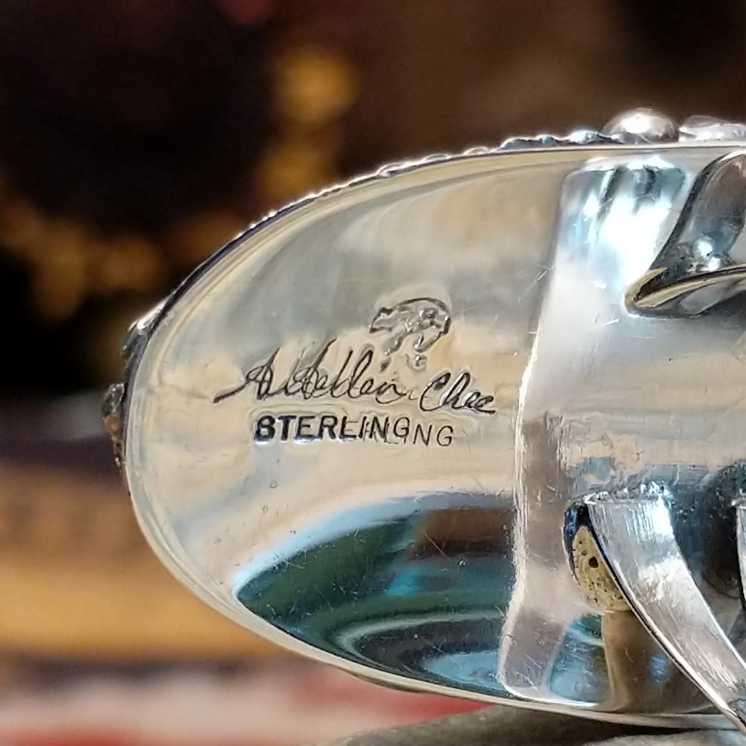 Handcrafted sterling silver ring by Navajo artist Allen Chee featuring a detailed eagle design in a traditional Southwestern Native American style.  Artisan and Sterling Silver stamp.