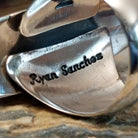 Handcrafted sterling silver navette ring by Ryan Sanchez featuring traditional stamped detailing in a Southwestern Native American design.  Artisan stamp.