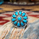 Handcrafted Navajo sterling silver ring by Lucy Jake featuring a turquoise stone with floral inspired traditional Southwestern design.