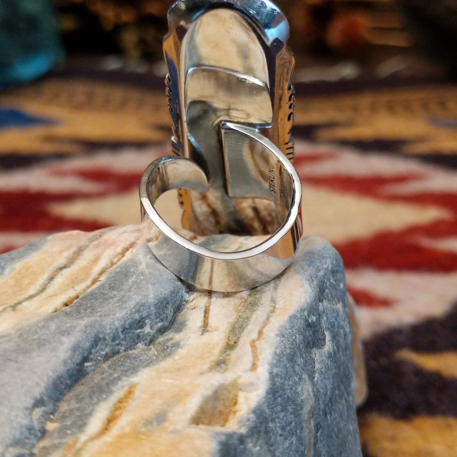 Handcrafted sterling silver ring by Toledo featuring three oval lapis stones in a vertical arrangement with geometric silver accents in a traditional Southwestern Native American design.  Underside view.