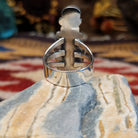 Handcrafted Navajo sterling silver ring by D.W. featuring multiple red coral stones arranged vertically with decorative silver scrollwork and traditional Southwestern detailing.  Underside view.