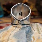 Handcrafted Navajo sterling silver ring by Murphy Platero featuring a raised oval turquoise stone surrounded by twisted wire, beadwork, and traditional Southwestern silver detailing.  Underside view.