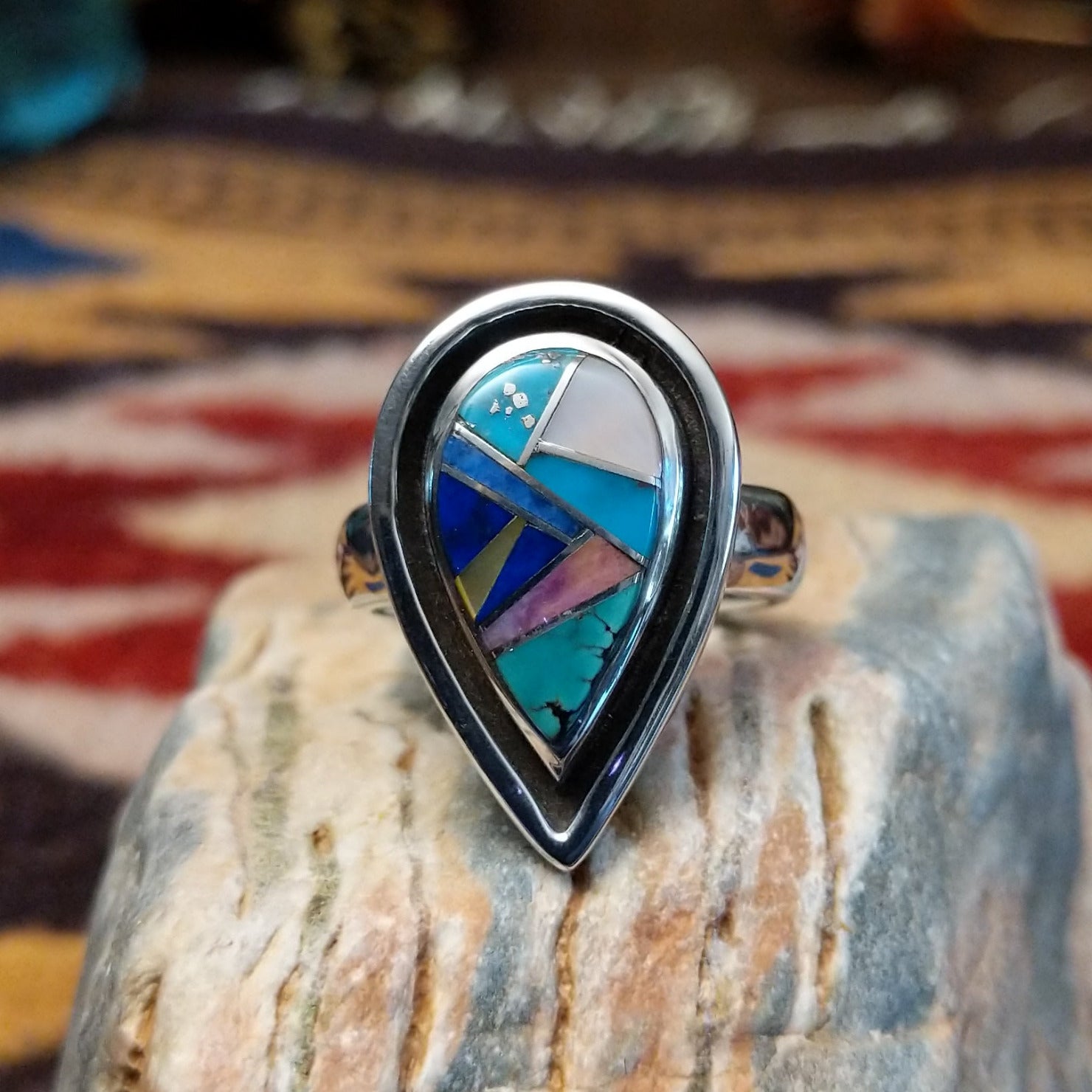 Handcrafted Navajo sterling silver teardrop ring by R.L. featuring colorful multistone inlay work in a traditional Southwestern Native American design.
