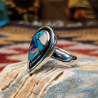 Handcrafted Navajo sterling silver teardrop ring by R.L. featuring colorful multistone inlay work in a traditional Southwestern Native American design.  Side view.