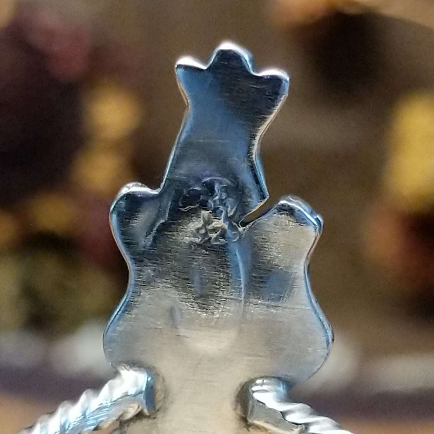 Handcrafted Navajo sterling silver ring featuring intricate silver detailing and traditional Southwestern craftsmanship in a bold regal design.  Artisan stamp.