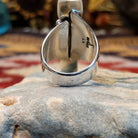 Handcrafted Navajo sterling silver ring by V.T. featuring a deep blue lapis stone in an abstract Southwestern design with intricate silver detailing.  Underside view.
