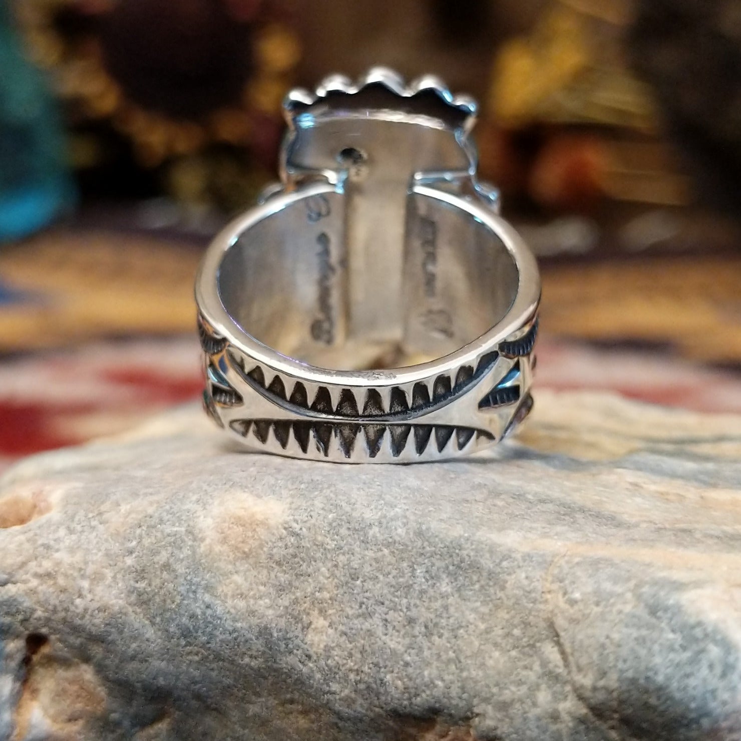Handcrafted sterling silver ring by Bernyse Chavez featuring multiple stacked coral stones in a bold vertical arrangement with traditional Southwestern Native American detailing.  Underside view.