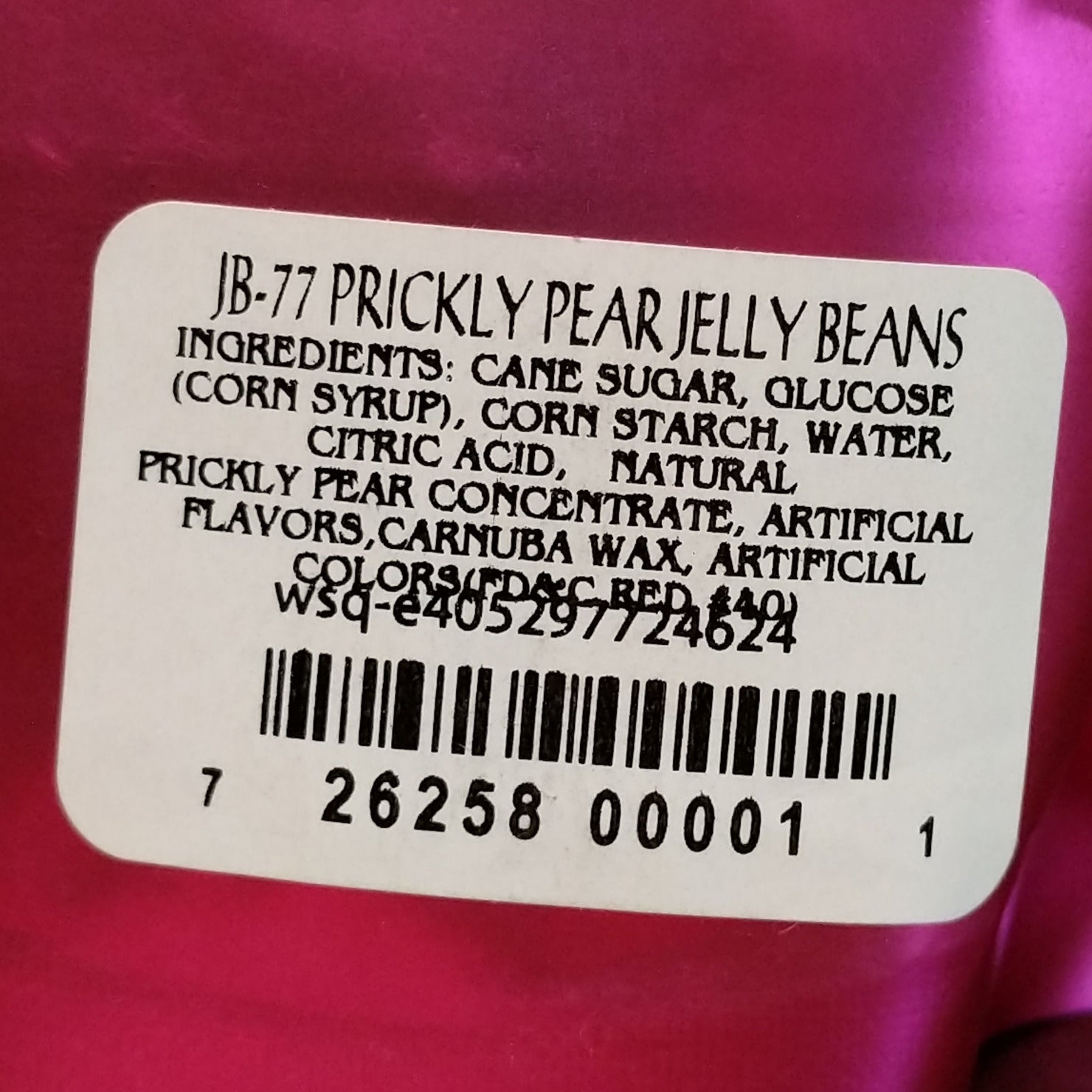 Colorful prickly pear jelly beans displayed in a pile, featuring vibrant pink and purple hues inspired by the sweet fruit of the prickly pear cactus. 