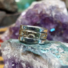 Handcrafted sterling silver and 14K gold band ring by Marc Antia featuring a stamped gold center with polished silver edges in a Southwestern Native American design.  