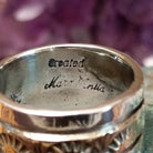 Handcrafted sterling silver and 14K gold band ring by Marc Antia featuring a stamped gold center with polished silver edges in a Southwestern Native American design.  Artisan Stamp.