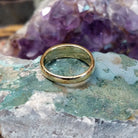 Handcrafted Navajo 14K gold ring featuring red coral inlay in a polished Southwestern Native American design.  Underside view.