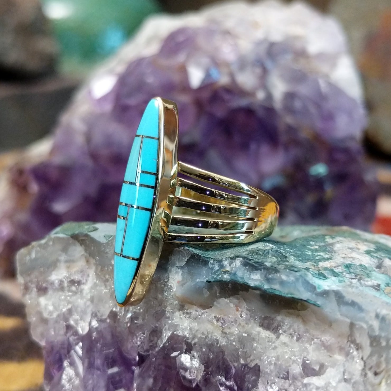Handcrafted 14K gold navette ring by R.D. featuring vibrant turquoise inlay in a traditional Southwestern Native American design.  Side view.