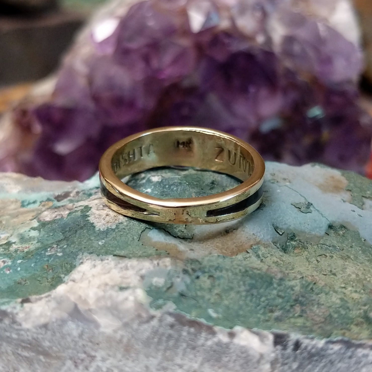 Zuni multistone inlay ring in 14K yellow gold by Charlotte Dishta, featuring precise geometric inlay work with multiple natural stones set into a polished gold band.  Underside view.