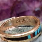 Zuni multistone inlay ring in 14K yellow gold by Charlotte Dishta, featuring precise geometric inlay work with multiple natural stones set into a polished gold band.  Artisan stamp.