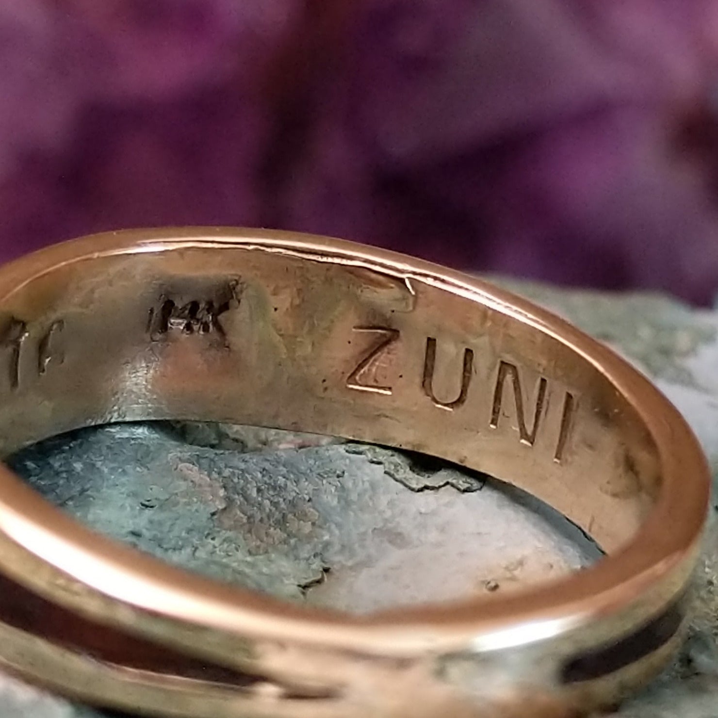 Zuni multistone inlay ring in 14K yellow gold by Charlotte Dishta, featuring precise geometric inlay work with multiple natural stones set into a polished gold band.  Zuni tribe stamp.