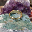 Navajo lapis inlay ring in 14K yellow gold, featuring deep blue lapis lazuli with natural flecks of pyrite set in a smooth polished gold band.  Underside view.