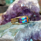 Two row multistone inlay ring in 14K yellow gold by Tom Billy, featuring colorful stone inlay arranged in parallel rows within a polished gold band.  Side view.