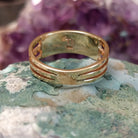 Two row multistone inlay ring in 14K yellow gold by Tom Billy, featuring colorful stone inlay arranged in parallel rows within a polished gold band.  Underside view.