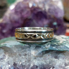 Silver and 14K gold stamped ring by Bruce Morgan, featuring handcrafted geometric stamp work, gold accents, and a polished sterling silver band.