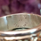 Silver and 14K gold stamped ring by Bruce Morgan, featuring handcrafted geometric stamp work, gold accents, and a polished sterling silver band.  Artisan, Sterling Silver, and 14K gold stamp.