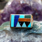 Multistone inlay ring in 14K yellow gold by Steve Francisco, featuring colorful stone inlay patterns set within a polished gold band.