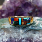 Multistone tiled inlay ring in 14K yellow gold by Steve Francisco, featuring a structured mosaic of individually cut stones set within a polished gold band.