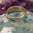 Multistone tiled inlay ring in 14K yellow gold by Steve Francisco, featuring a structured mosaic of individually cut stones set within a polished gold band.  Underside view.