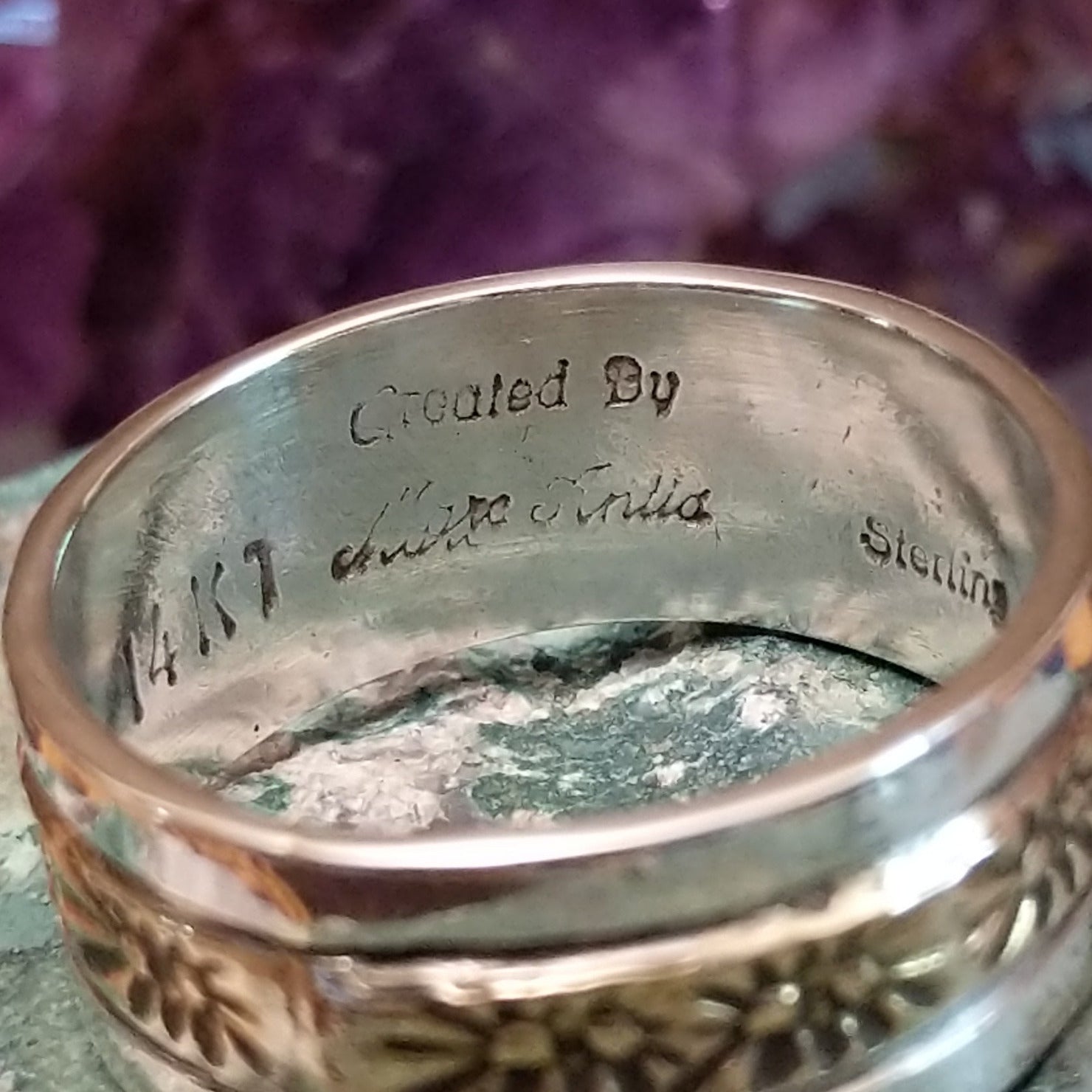 Silver and 14K gold stamped ring by Marc Antia, featuring hand-stamped geometric patterns, gold accents, and a polished sterling silver band.  Artisan, Sterling Silver, and 14K gold stamp.
